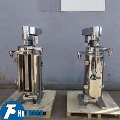 High Capacity Tubular Centrifuge for Liquid Liquid Solid Separation Featuring Effective Gravity Based Phase Discharge System