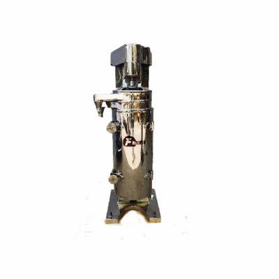 Centrifugeuse tubulaire conçue pour la séparation continue de deux liquides non miscibles et de solides en suspension avec une perte de produit minimale